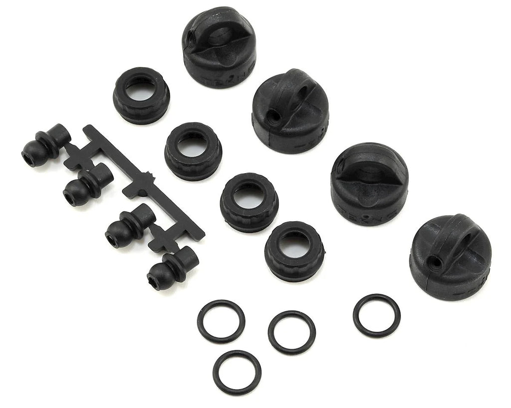 TKR6712 – Shock/Cartridge Cap & Bushing Set (4pcs each, EB410)