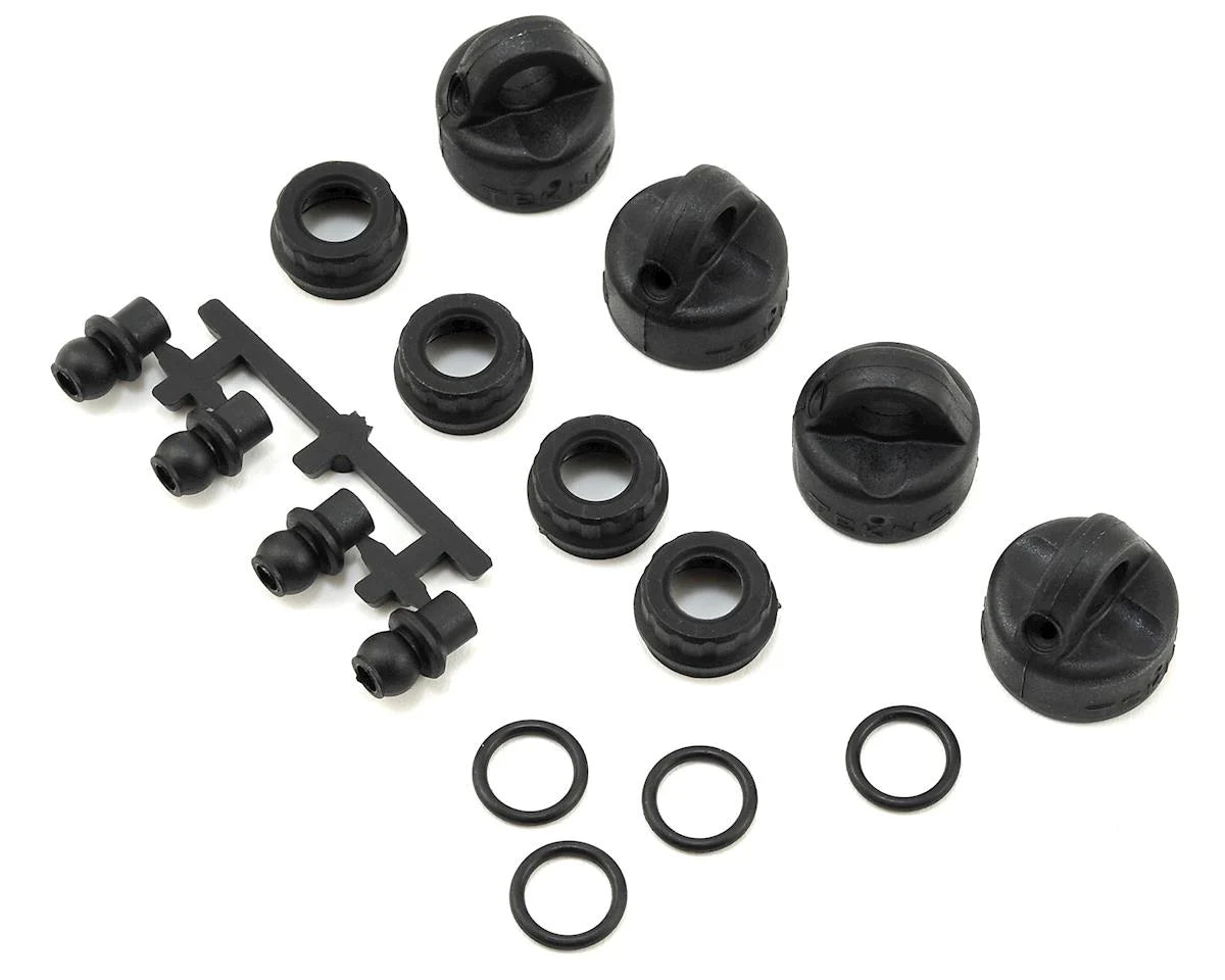 TKR6712 – Shock/Cartridge Cap & Bushing Set (4pcs each, EB410)